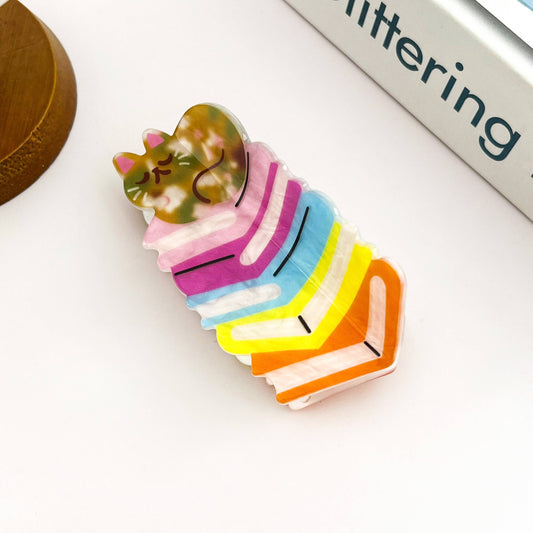 Adorable Sleeping Cat on Rainbow Book Stack Hair Claw: Book-Cat